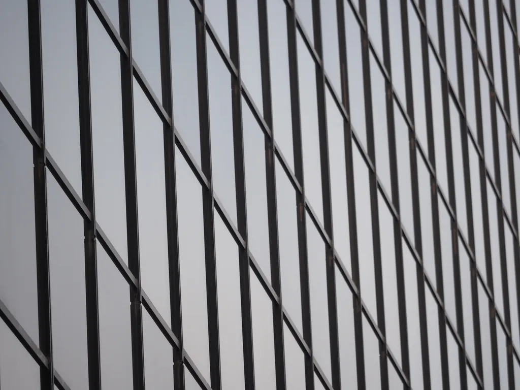 the windows of a multi-storey glass building with no obvious reflection