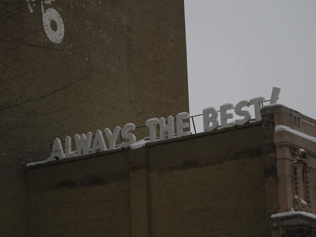 a brick building with snow-covered 3d letters on top: always the best!