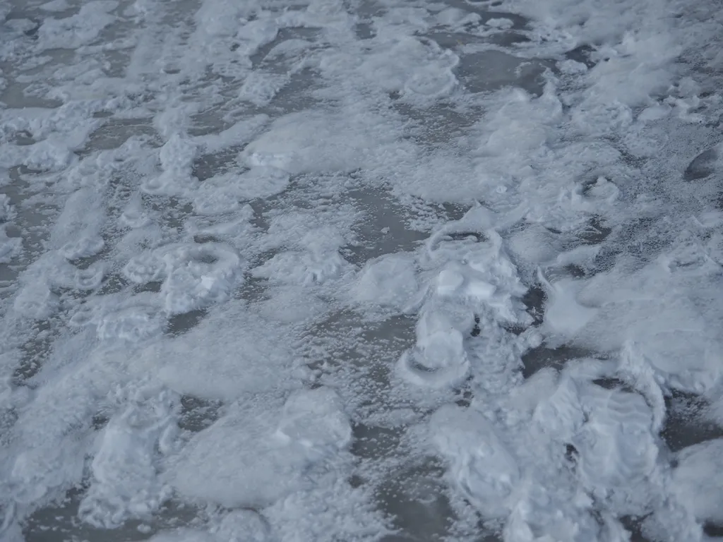 inverted footprints on a frozen path