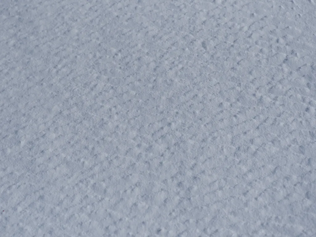 textured snow on a frozen river