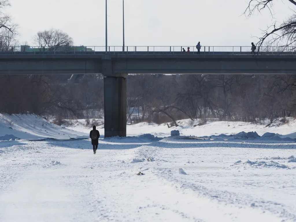 a person walking on a frozen river